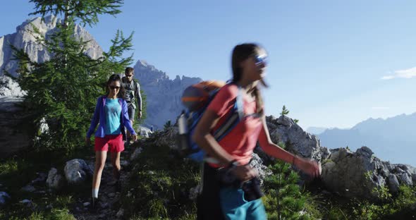 Four Friends Walking Along Hiking Trail Path