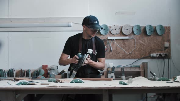 Man Worker Preparing Instruments for Carpentry Work