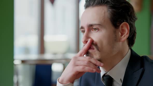 Headshot Portrait of Sad Stressed Handsome Businessman in Suit Touching Face and Thinking