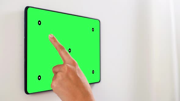 Hand Touching Tablet Pc Green Screen at Smart Home