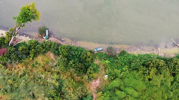 Aerial drone footage of Danube river in birds eye view. Nature video of river with fishing boats.