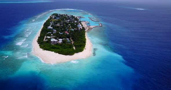 Tropical flying island view of a white paradise beach and aqua blue water background in colourful 4K