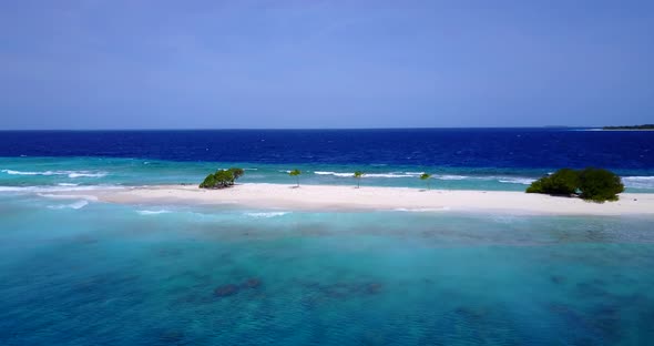 Natural aerial clean view of a sunshine white sandy paradise beach and aqua turquoise water backgrou