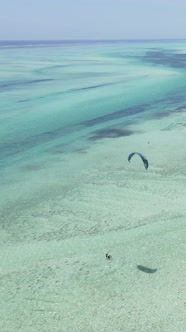 Tanzania  Vertical Video Kitesurfing Near the Shore of Zanzibar Slow Motion