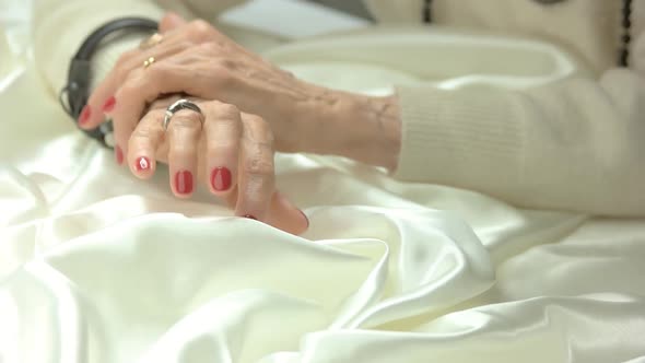 Senior Woman Manicured Hands with Jewelry.