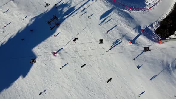 Aerial View of the Alps Mountains in France. Mountain Tops Covered in Snow. Alpine Ski Facilities