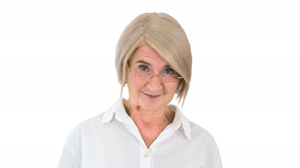 Grandmother in Glasses and with Gray Hair Happy and Smiling Looking To Camera on White Background
