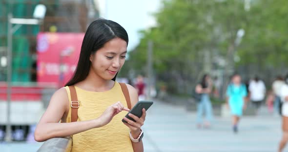 Woman Use of Mobile Phone in City