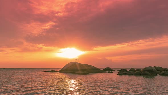 Sea Stones at Colorful Sunset and Beautiful Cloudscape