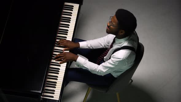 Top View of Stylish Man Playing Grand Piano