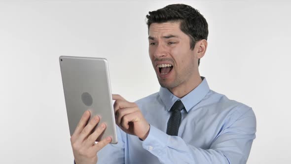 Businessman Reacting to Loss While Using Tablet