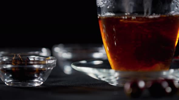 Stirring Sugar in a Cup of Tea with a Spoon, Close Up Footage, 