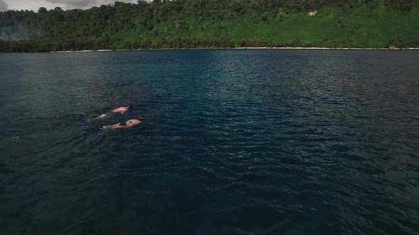 Snorkeling in Tropical Sea, Aerial View of Couple in Lagoon Near Exotic Island