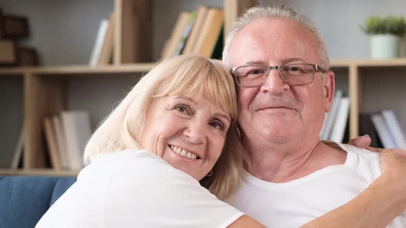 Portrait of an Elderly Husband and Wife in Love Smiling at the Camera