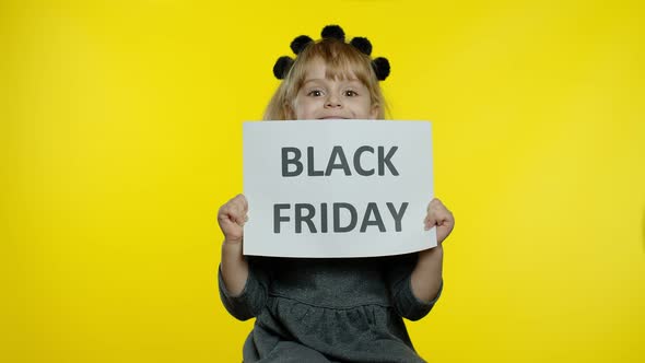 Child Girl Showing Black Friday Inscription Banner Text Advertisement. Low Prices Online Shopping