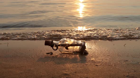 Message in the Bottle Against the Sun Setting Down