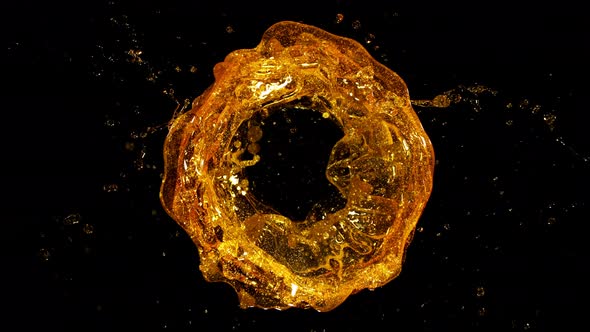 Super Slow Motion Shot of Rotating Oil Whirl Isolated on Black Background at 1000Fps