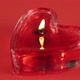 one heart shaped candle burning on red background - VideoHive Item for Sale