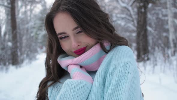 Beautiful Woman in Snowy Countryside