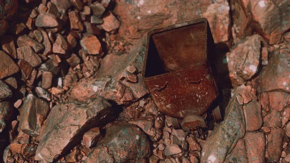 Abandoned Rusty Mine Cart on Rocks