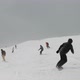 Slow Motion of a Group of Skiers and Snowboarders on the Slopes of the Ski Resort. - VideoHive Item for Sale