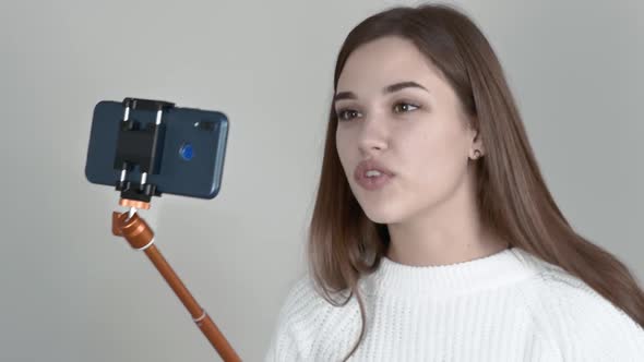Caucasian Girl Blogger Is Recording a Video Message To His Subscribers.