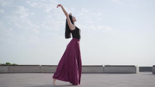 Elegant Slim Ballerina Dancing Classical Ballet at City Square, Wide Shot Portrait of Charming