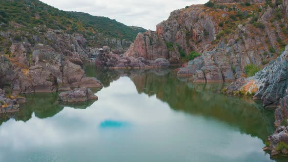 Aerial View of the Mountain River Near Mertola