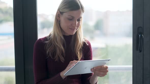 Businesswoman using tablet in office