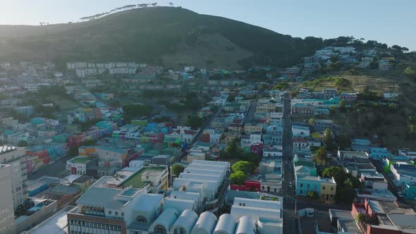 Aerial Footage of Brightly Coloured Houses on Slope of Signal Hill in Bo Kaap Residential Borough