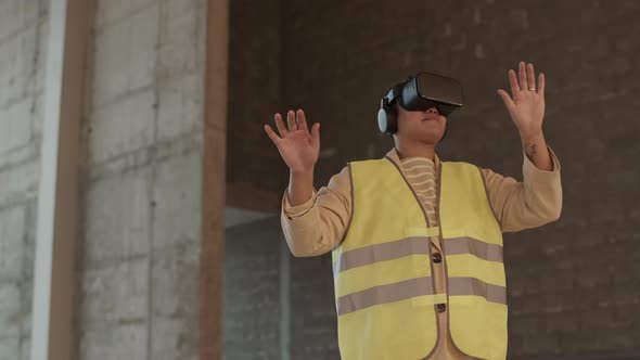 Worker Using VR-goggles on Construction Site