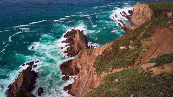 View from Top of Huge Cliff with Breaking Ocean Waves in Big Sur, Cali