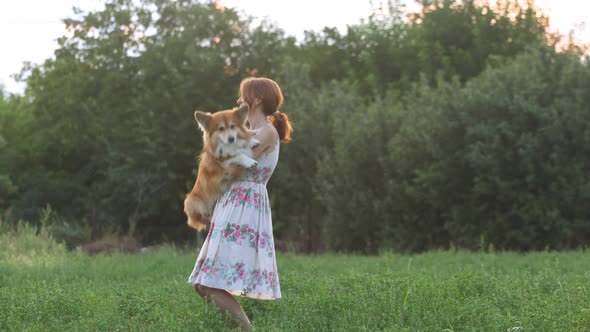 Smiling Woman Holding A Dog 4