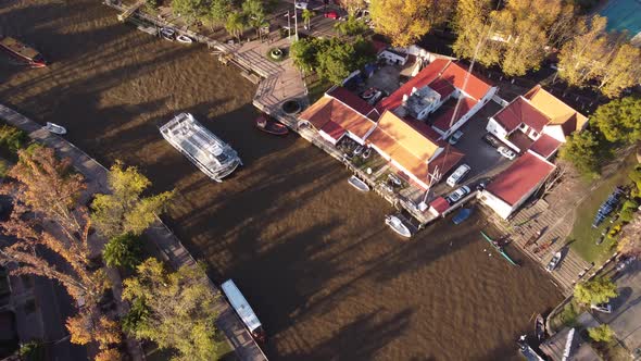 Tourboat on tourist boat along river in Tigre province of Buenos Aires, Argentina. Aerial overhead v