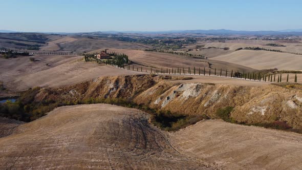 Crete Senesi Tuscan Rolling Hills and Cypress Road Aerial View in Tuscany