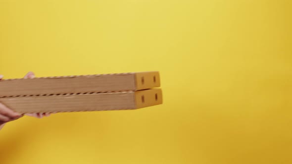 Square Cardboard Boxes on Yellow Background