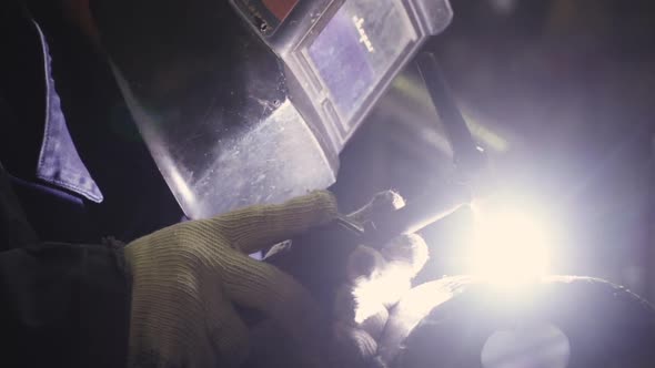 Close Up Of A Welder's Mask While Welding