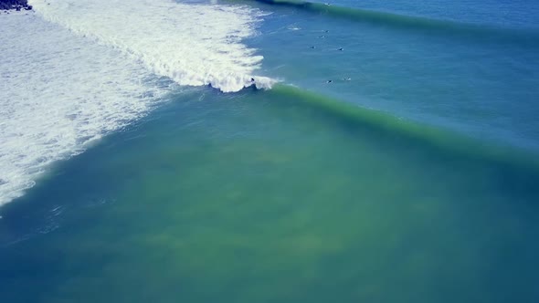 Aerial view of surfing waves in New Zealand