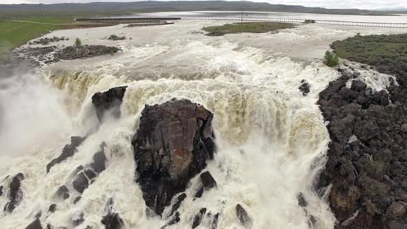 Aerial view of huge overflow waterfall at Magic Reservoir