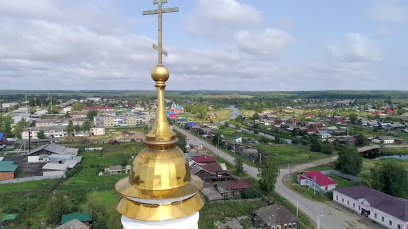 Aerial view of Church in the village. Near the river and bridge