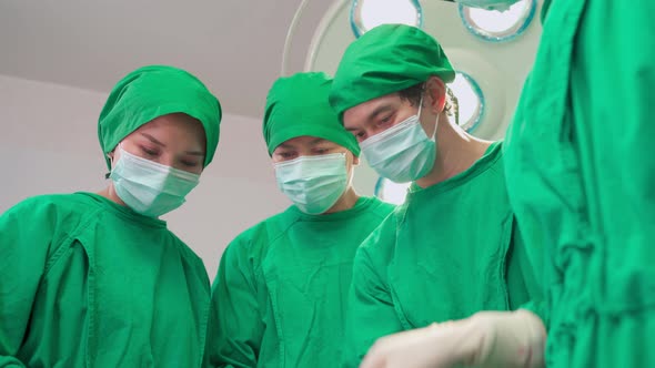 Group of Asian professional  doctors surgeons and nurses team starting the operation in hospital.