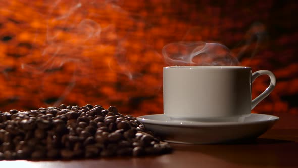 Cup on a White Saucer of Hot Coffee on the Aroma Spreads Room