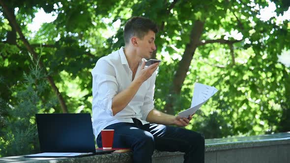 Businessman Watches Financial Report