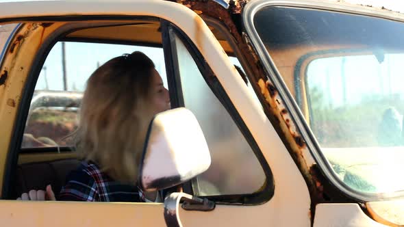 Woman getting down from the car 4k