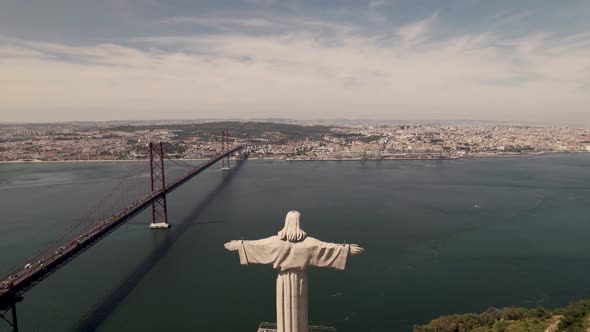 Aerial view of Catholic statue Christ the King at Almada overlooking Lisbon.