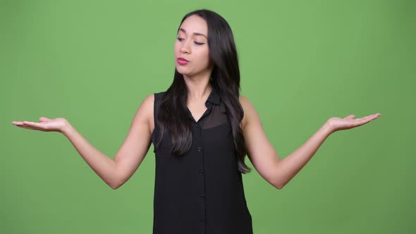 Young Beautiful Asian Businesswoman Choosing Between Left and Right