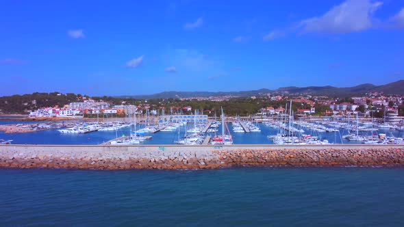 Lateral traveling from left to right on the breakwater jetty side. Port of Creixell in Catalonia - S