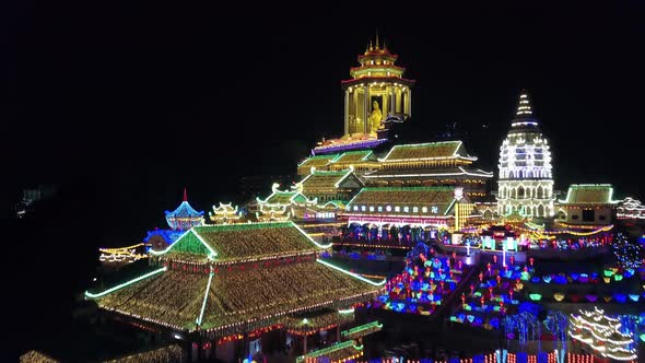 Aerial view rise up Kek Lok Si temple at night with colorful lantern.