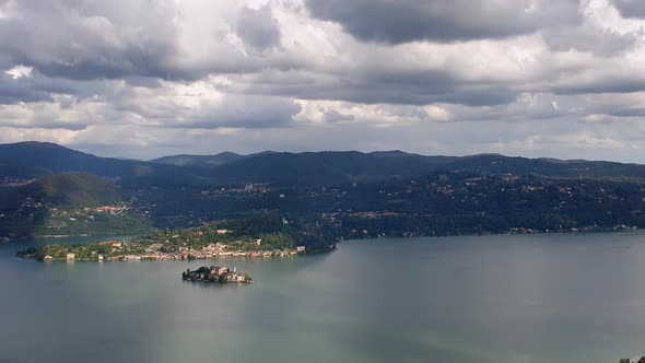 Isola di San Giulio or Saint Julius island on Orta lake in Piedmont, Italy. Zoom out