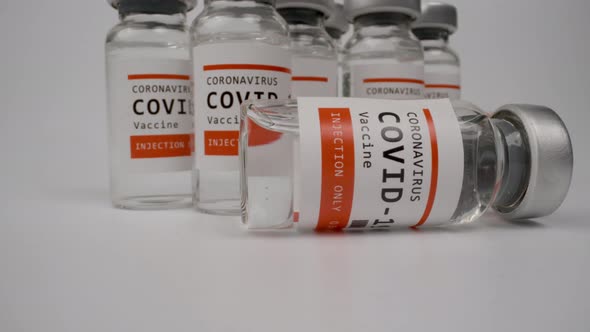 Glass Vials of the Covid19 Vaccine Against White Background